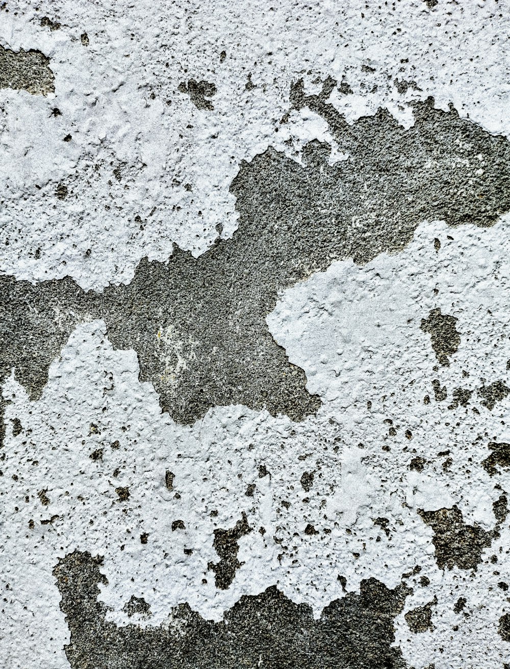 a close up of a white and black wall
