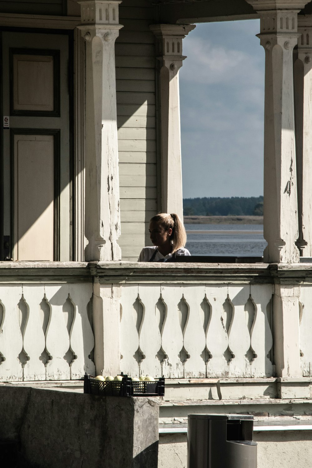 a couple of people that are sitting on a balcony