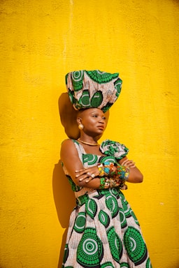 a woman in a green and white dress and hat