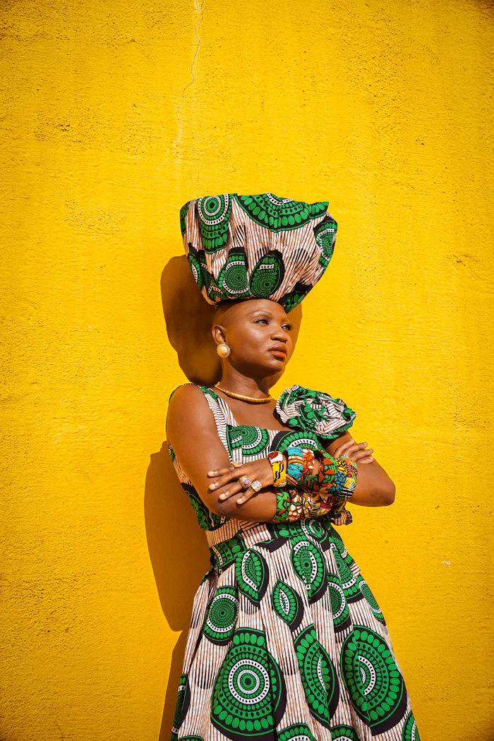 Woman in a green and white traditional dress and hat