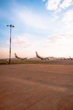 a couple of airplanes that are on a runway