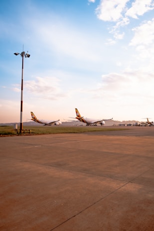 a couple of airplanes that are on a runway