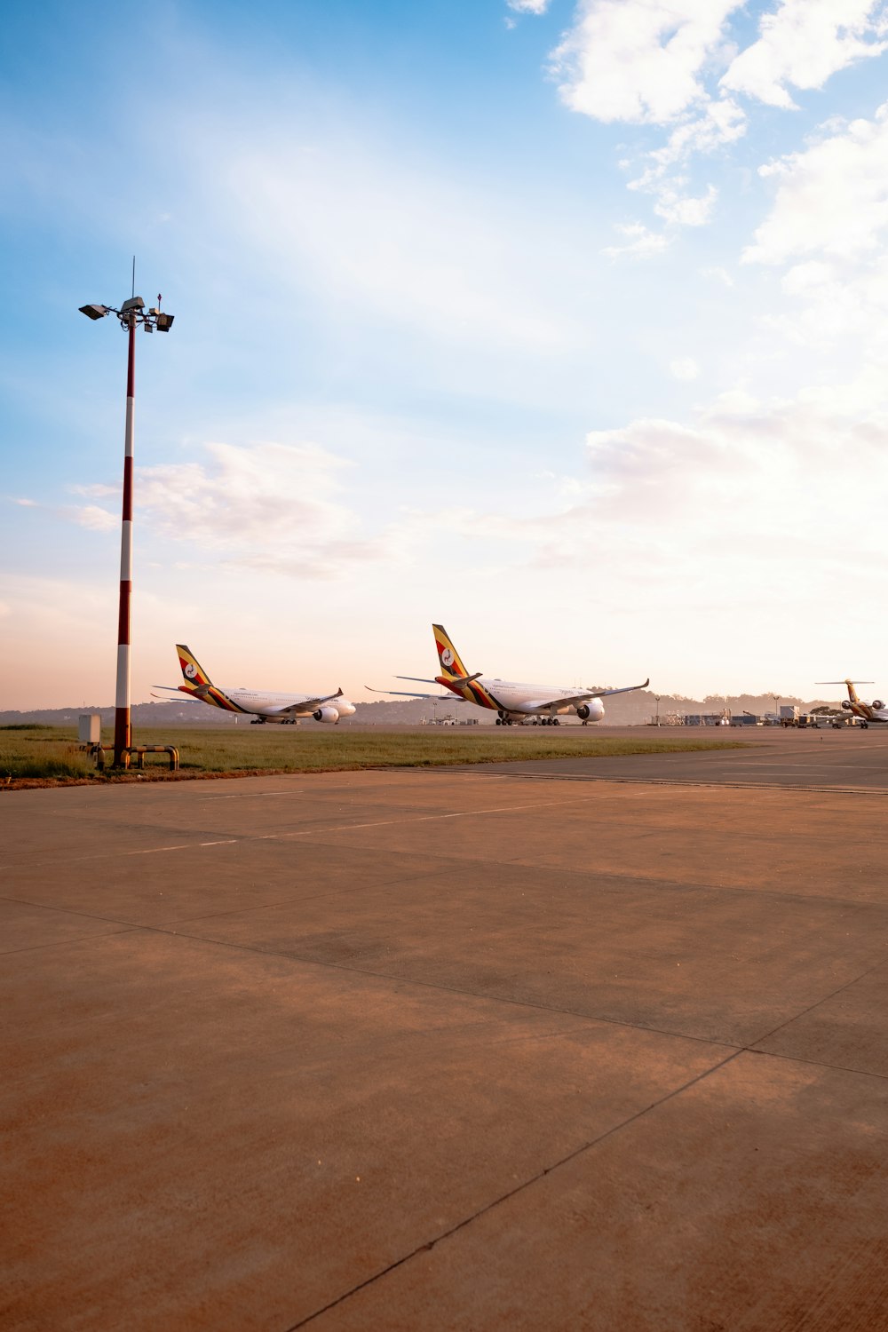 a couple of airplanes that are on a runway