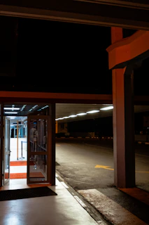 A nighttime shot of an illuminated automatic handicap door providing secure and easy entry.