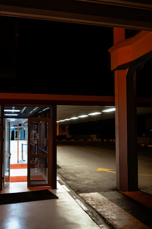 A nighttime shot of an illuminated automatic handicap door providing secure and easy entry.