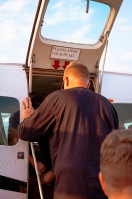 Two flight students preparing for a lesson beside a light aircraft.