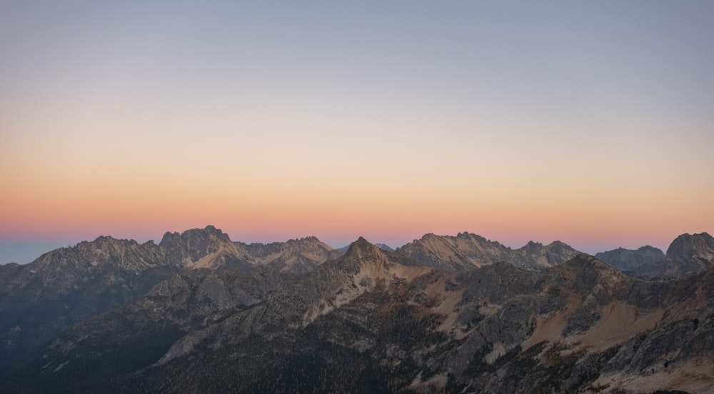 a view of a mountain range at sunset