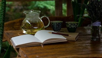 an open book sitting on top of a wooden table