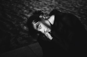 A peaceful figure bathed in soft periwinkle light, eyes closed in contemplation