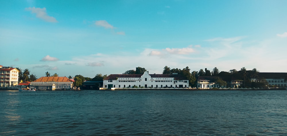 a body of water with houses on the shore