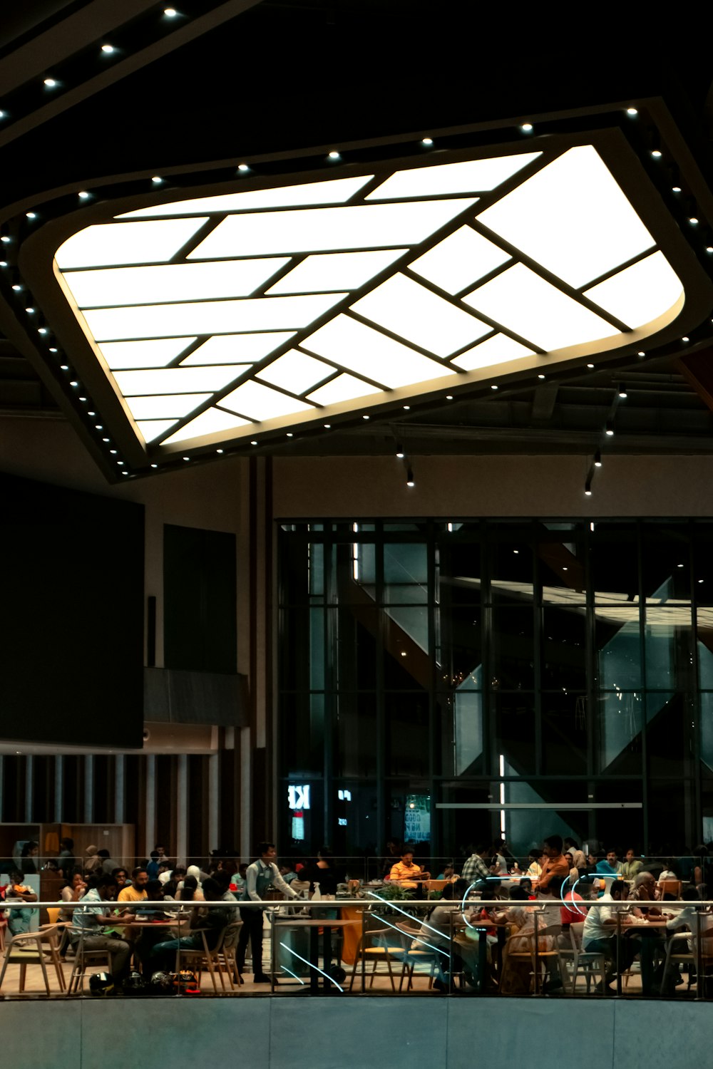 a group of people sitting at tables in a building