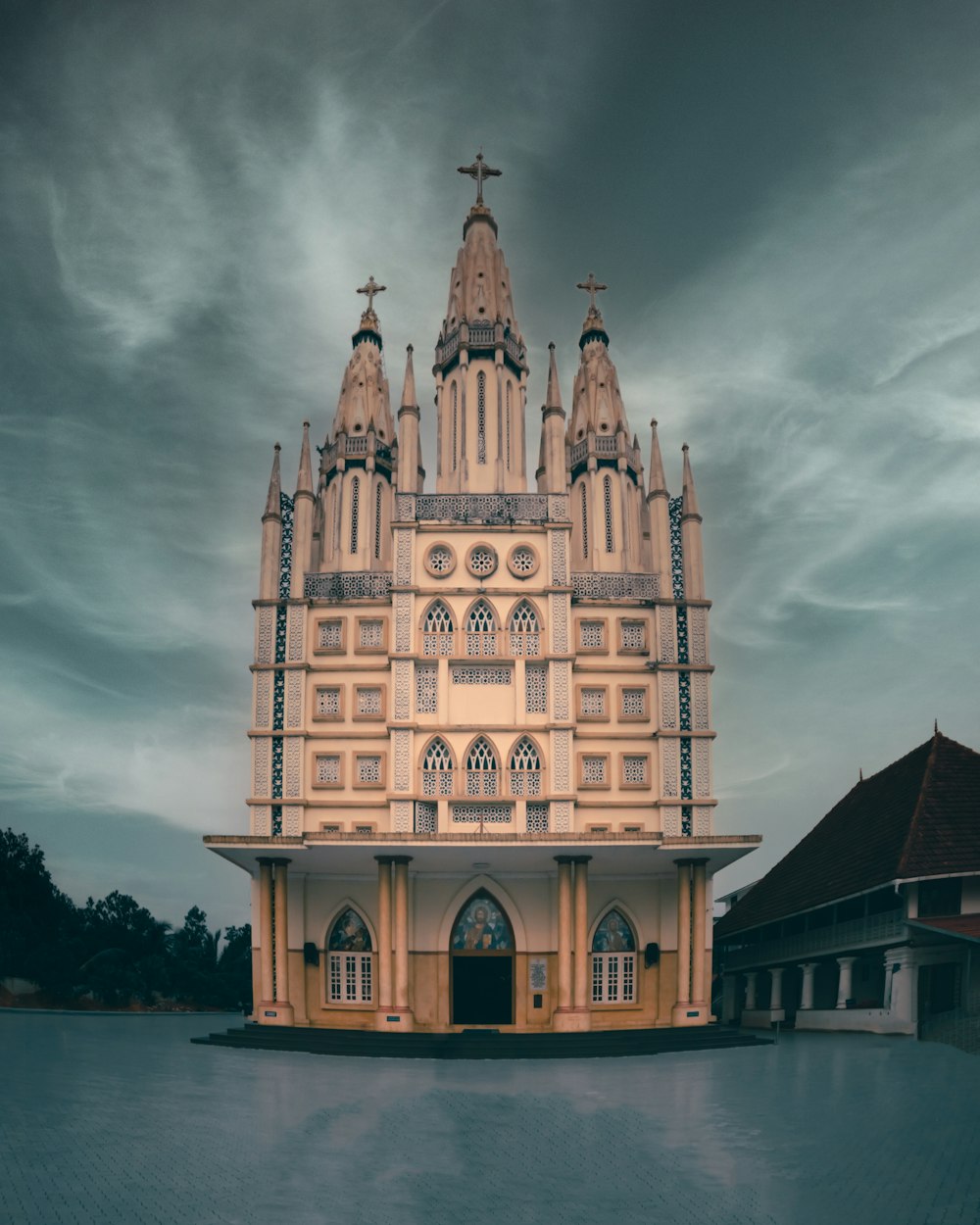 a large building with a cross on top of it