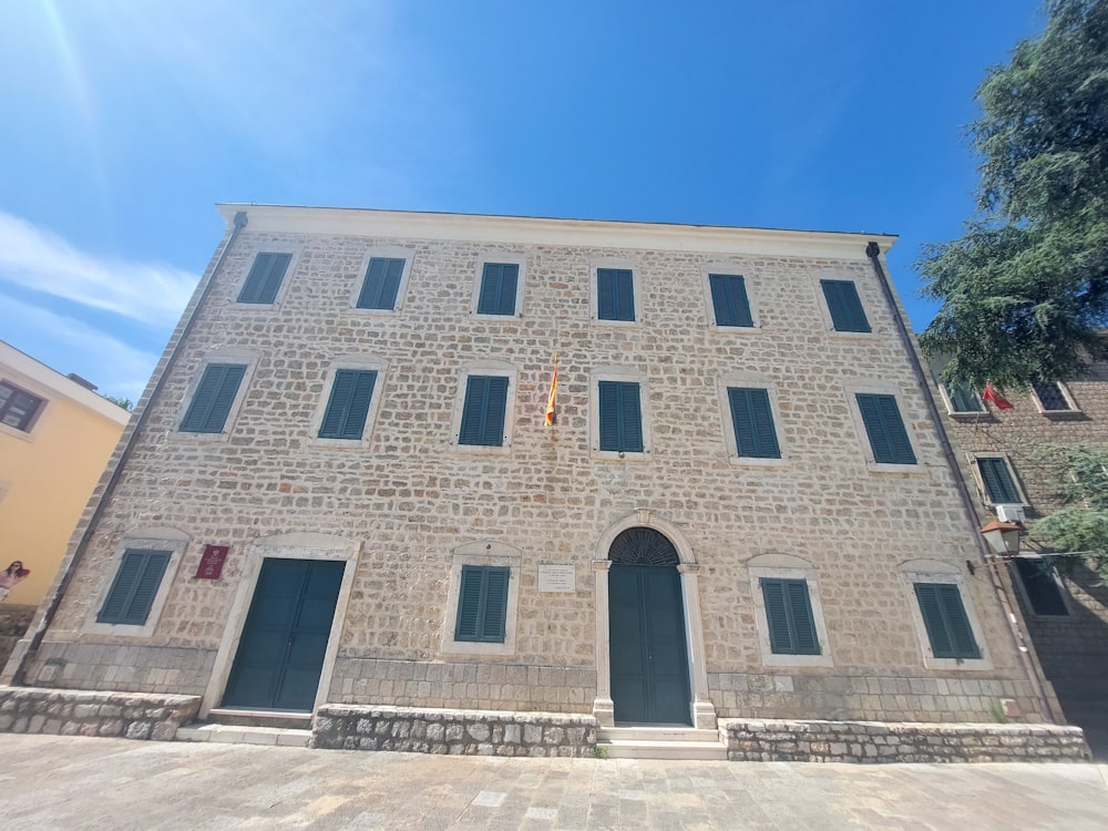 a brick building with a clock on the front of it