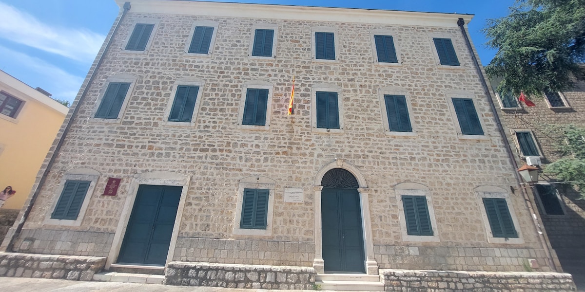 a brick building with a clock on the front of it