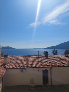 Rooftop view of a luxury apartment overlooking the sea.