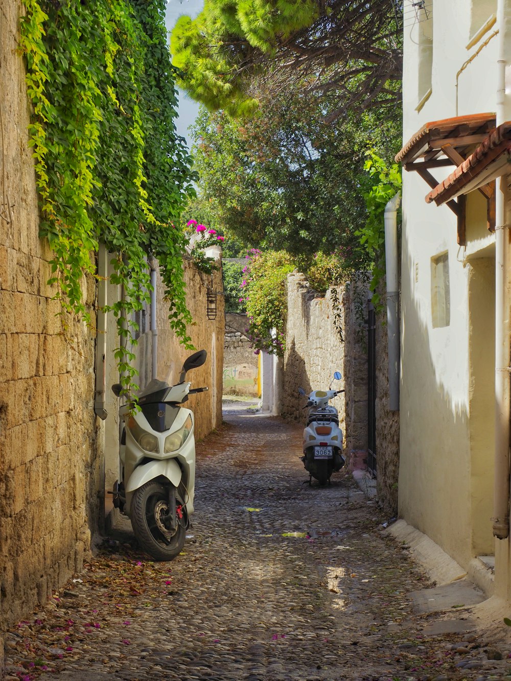 a scooter parked on the side of a street