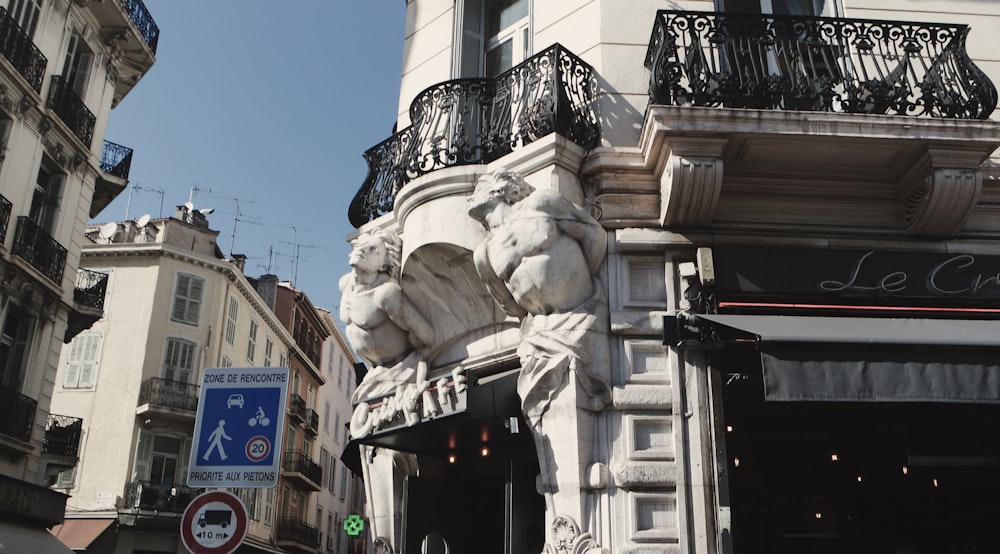 a building with a statue of a lion on the front of it
