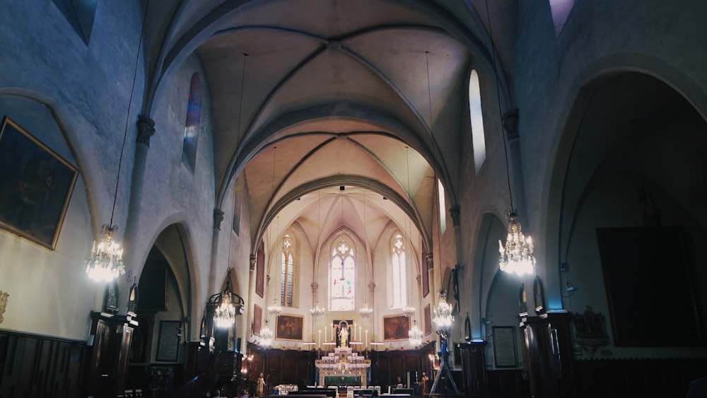 a large cathedral with high ceilings and chandeliers