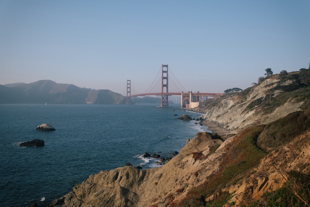 a view of the golden gate bridge from a cliff
