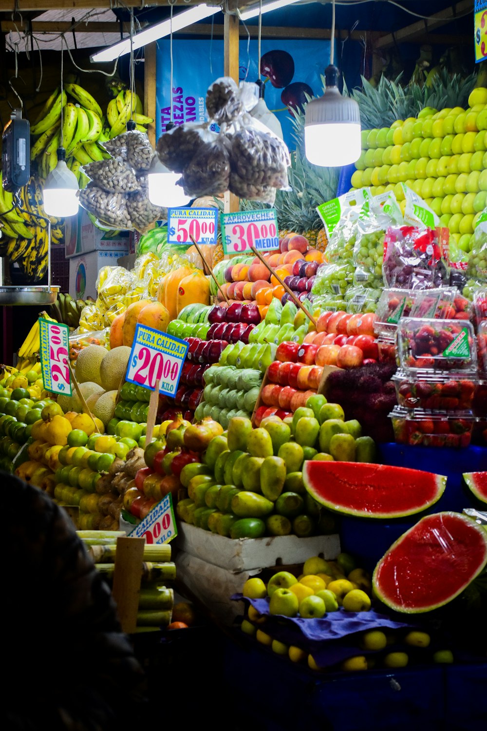 a fruit stand filled with lots of different types of fruit