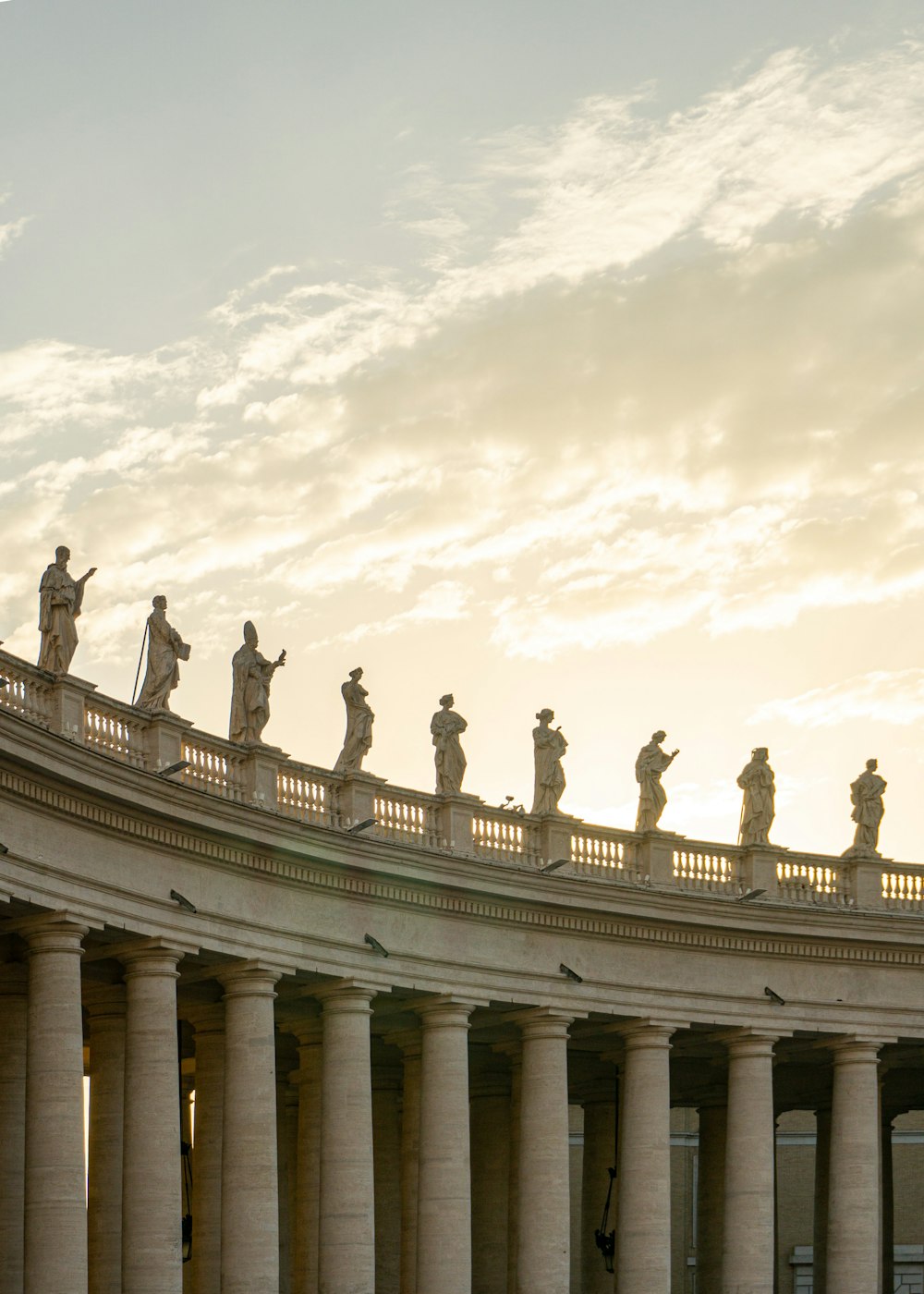 a group of statues on top of a building