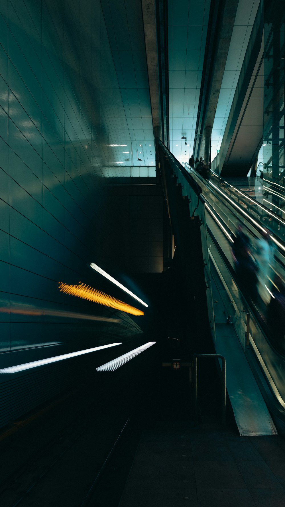 a blurry photo of a train going through a tunnel