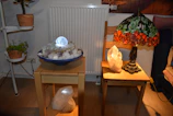 A cozy consultation room with mystical decorations and a glowing crystal ball.