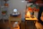 A peaceful indoor setting with warm lighting and calming crystals arranged for a psychic session.