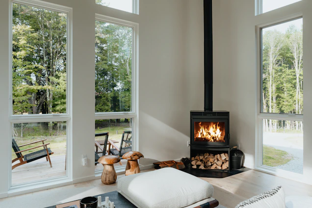 A cozy renovated home with visible insulation layers and a modern heat pump installation.