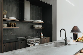 a kitchen with a sink and a stove top oven