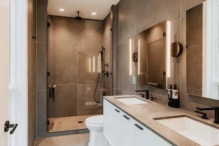 Remodeled bathroom with double sinks and walk-in shower