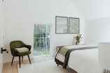 Peaceful bedroom featuring soft linens and a view of the lush Everglades greenery.