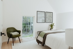 Peaceful bedroom featuring soft linens and a view of the lush Everglades greenery.