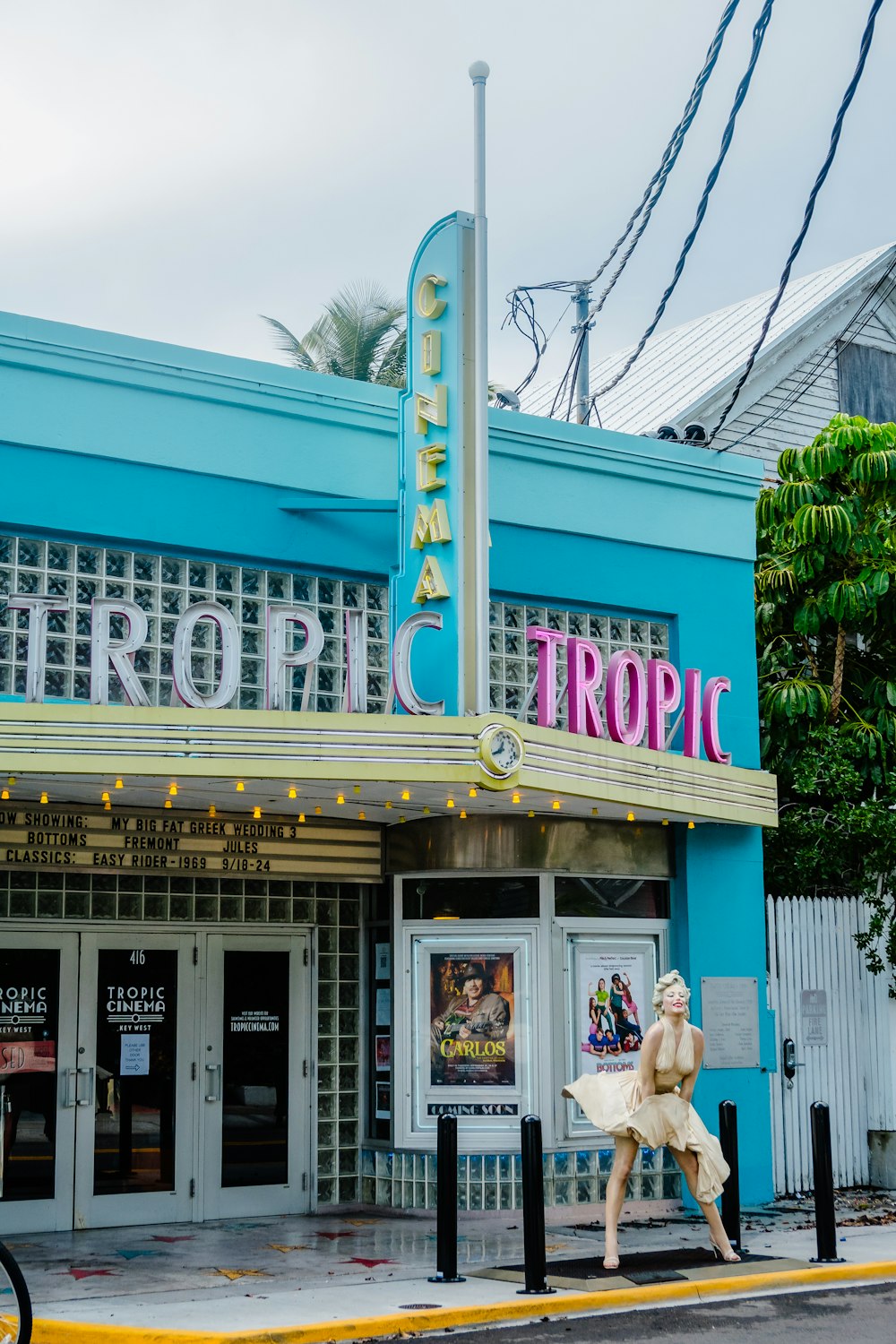 a movie theater with a sign that says tropic