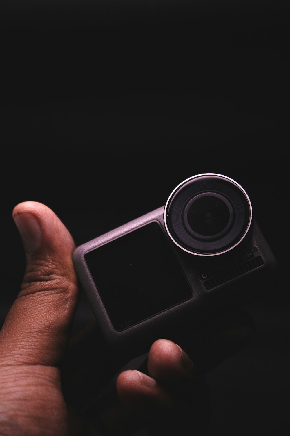 a person holding a camera in their hand