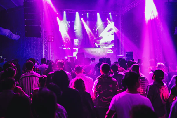 a crowd of people standing around a stage