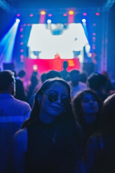 a woman standing in front of a crowd of people