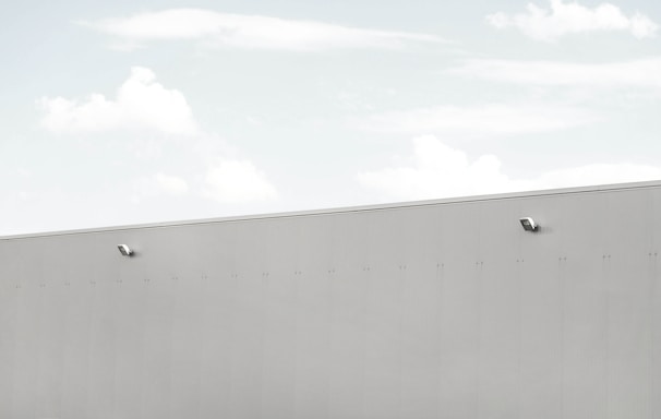 Modern security system installation with blue and gray tones in a sleek office environment.