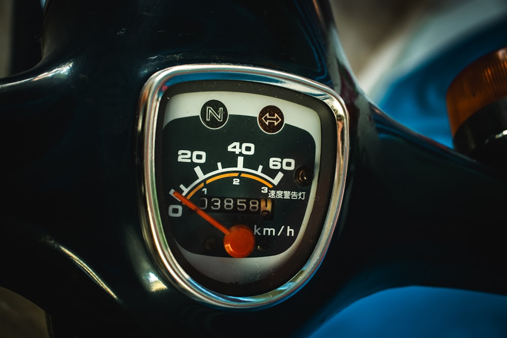 a close up of a speedometer on a motorcycle