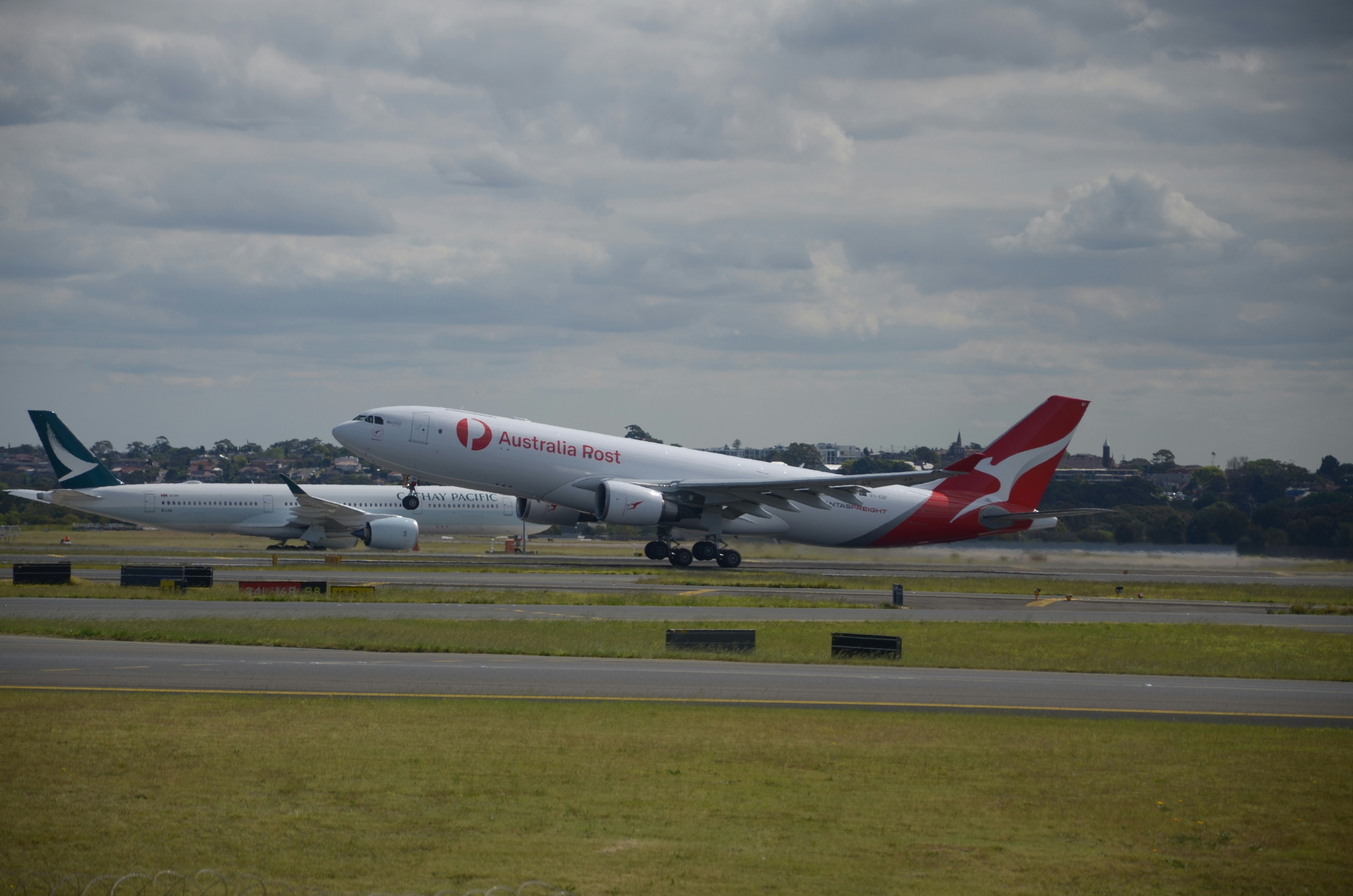 a large jetliner sitting on top of an airport runway