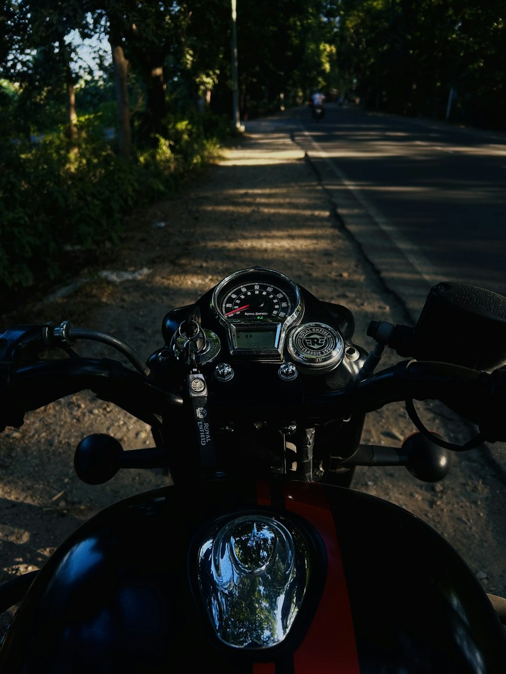 a motorcycle parked on the side of a road