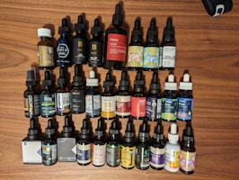 Assorted CBD oils and tinctures neatly arranged on a wooden table
