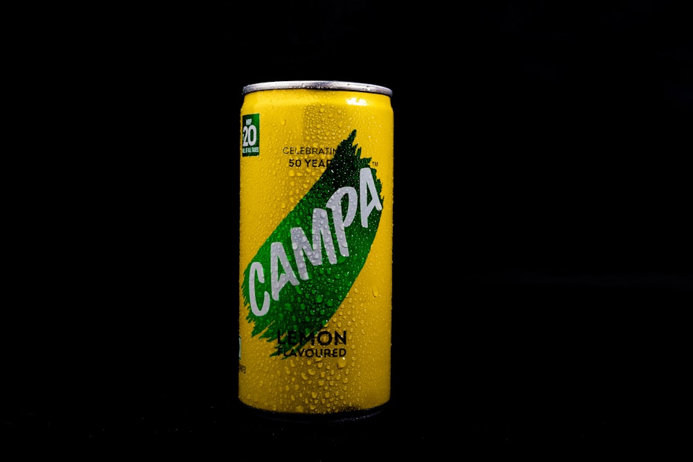 a can of campa on a black background