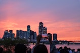 A scenic view of a city skyline with influencers filming.
