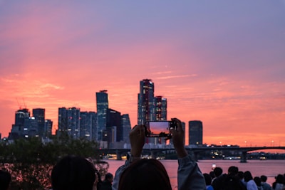 A scenic view of a city skyline with influencers filming.