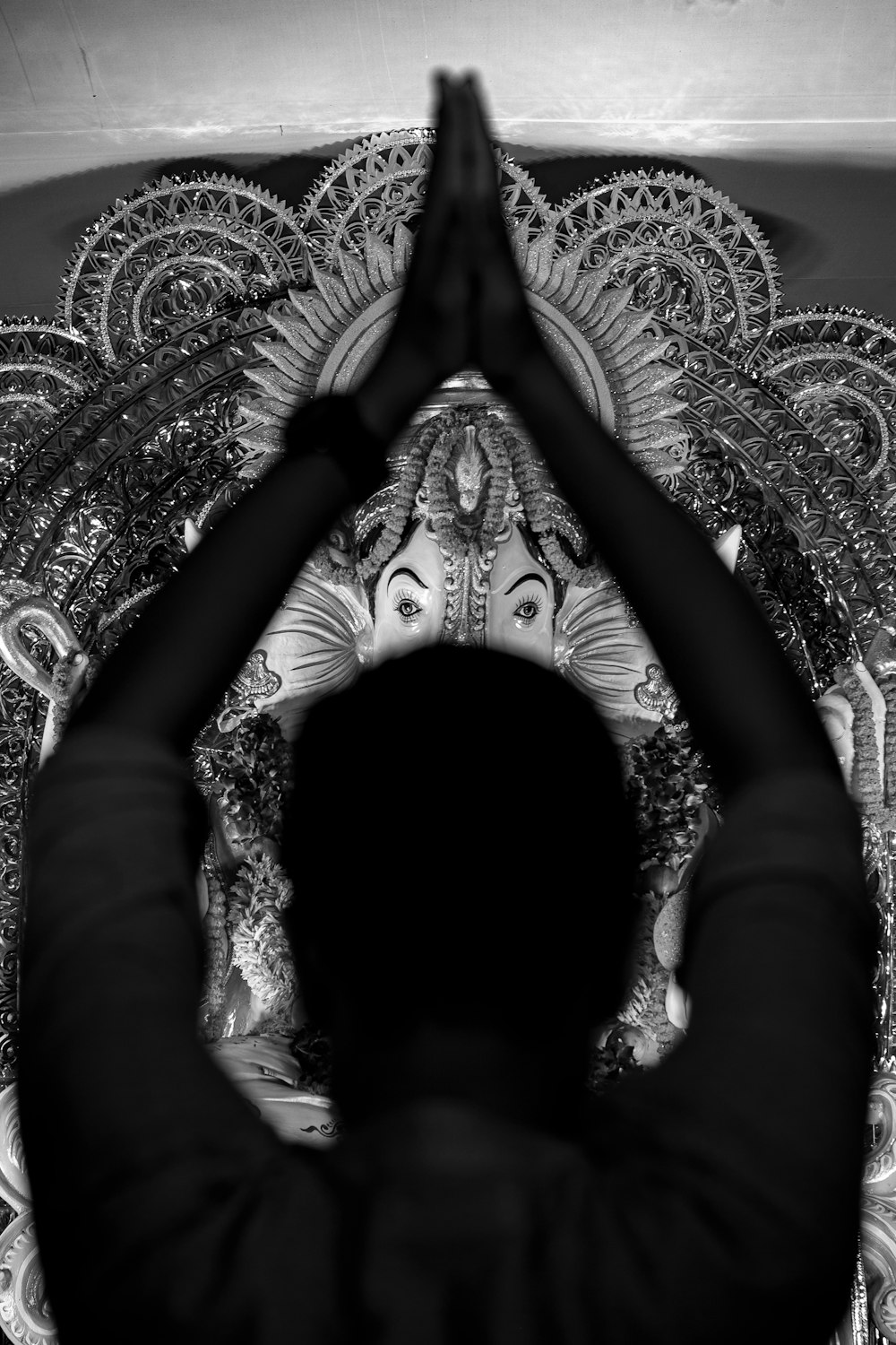 a black and white photo of a person doing yoga