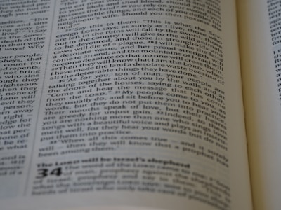A close-up of a page from a book, featuring printed text in columns. The text is aligned and appears to be extracted from a religious or philosophical context.