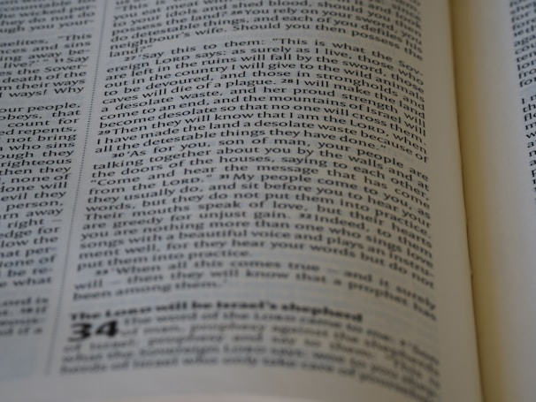 A close-up of a page from a book, featuring printed text in columns. The text is aligned and appears to be extracted from a religious or philosophical context.