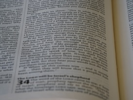A close-up of a page from a book, featuring printed text in columns. The text is aligned and appears to be extracted from a religious or philosophical context.