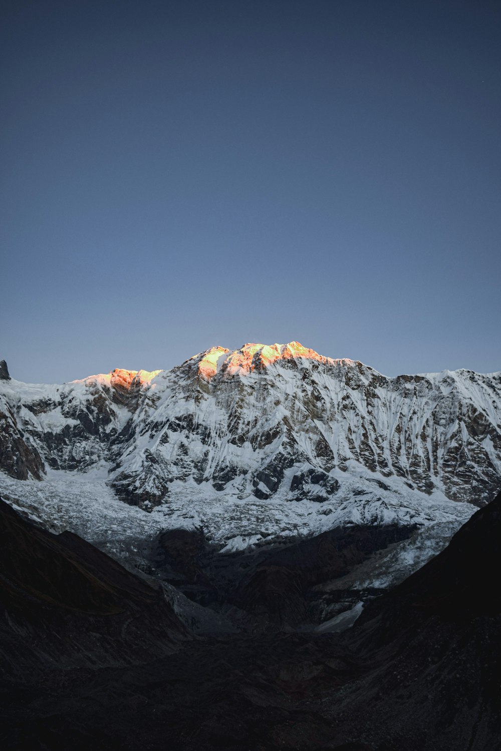 a snow covered mountain with a sky background